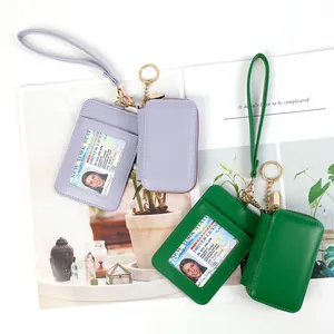 Faux leather wristlet wallet set with clear ID window and zipper pouch in purple and green