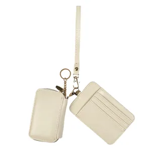 Cream faux leather wallet set with card slots, zipper pouch, and gold wristlet strap