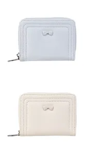Detail of light blue and beige mini zip wallets featuring elegant bow knots and neat stitching