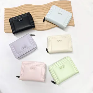 Short macaron-colored zip wallets for women with cute bow tie and smooth stitching