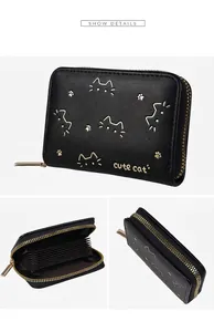 Detail of cute cat black PU leather wallet with accordion card slots and golden zipper