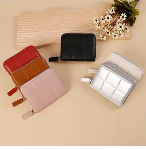 Quilted zip-around mini wallets in multiple colors with sleek leather texture