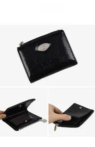 Detail view of black glossy zipper wallet with multiple card slots and clear ID window
