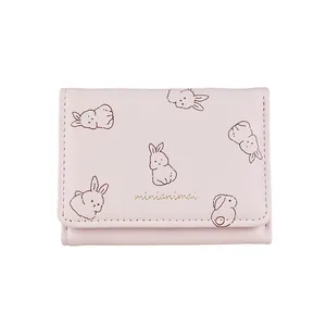 Pink PU leather short wallet with cute cartoon rabbit patterns and gold lettering