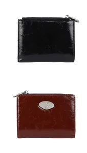 Vertical view of black and wine red pleated crinkle leather zip wallets with metal logo