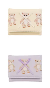 Close-up of teddy bear prints and ribbon bow details on cute tri-fold PU leather wallets