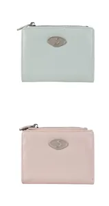 Macro detail of mint green and pink wrinkled texture wallets with silver zipper and emblem