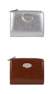 Detailed view of silver metallic and brown oil wax leather zip wallets with crinkle texture
