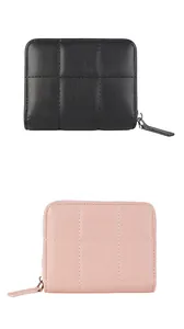 Detail showing black and pink quilted wallets with square stitching and metal zippers