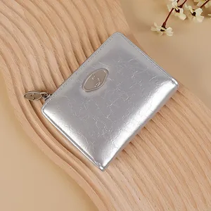 Minimalist silver wrinkled texture zip wallet with elegant metallic brand logo