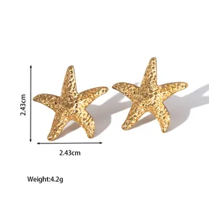 Detailed view of gold starfish earrings with textured surface, 2.43cm size and 4.2g weight