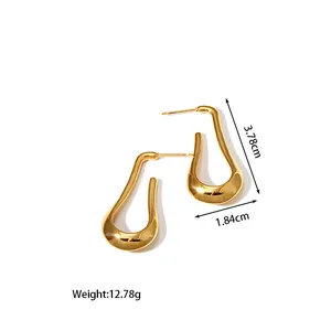 Detailed view of U-shaped gold earrings with dimensions 3.78cm height and 1.84cm width