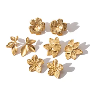 Set of four gold-plated stainless steel stud earrings with floral and leaf patterns