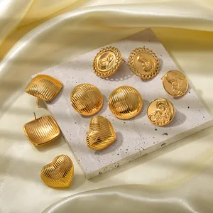 Vintage 18k gold plated stainless steel heart and relief earrings set on stone