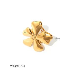 Detailed view of large golden flower ring showing 3.3cm diameter and 7.4g weight specs