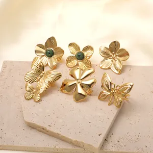 Collection of 18k gold plated stainless steel rings with butterfly and flower designs