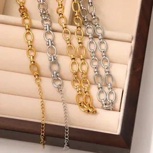 Minimalist gold and silver spliced industrial chain necklace with extended droplet pendant