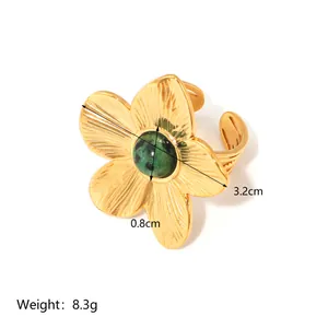 18k gold plated stainless steel flower ring with emerald green stone and open design