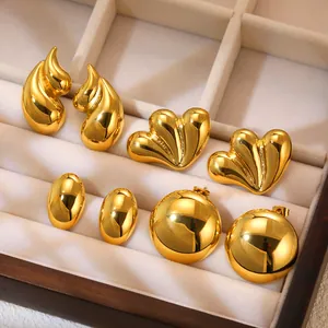 Polished gold stainless steel earring set with drop, heart and oval geometric shapes