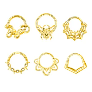 Collection of gold 316L stainless steel hinged clickers with snake and spider web designs