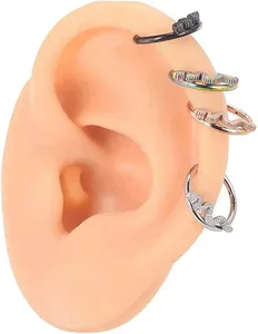 Detail of snake-shaped 316L stainless steel nose rings on silicone ear model