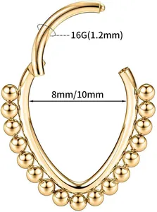 Detail of 16G gold heart clicker ring with beaded edge for nose or ear piercings