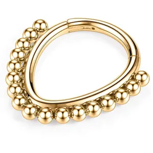 Gold 316L stainless steel septum clicker ring featuring a beaded outer edge design