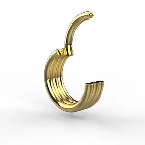 Macro detail of gold four-layer stacked hinged clicker hoop ring in polished steel
