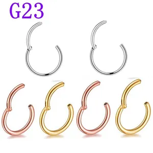 Detailed view of G23 titanium septum rings in silver, rose gold, and gold finishes