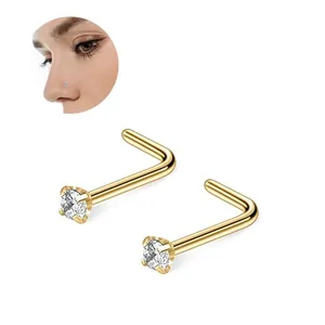 L-shaped gold nose stud with clear zircon crystal showing nose wing piercing effect