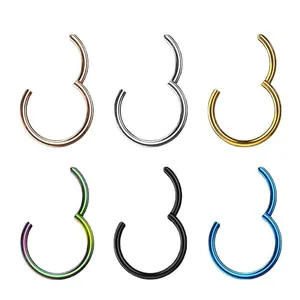 Detailed close-up of six titanium segment rings in various metallic finishes and colors