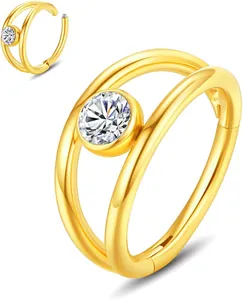 Close-up of golden 316L stainless steel nose ring with sparkling zircon and hinged closure