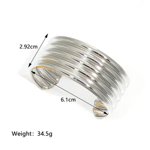Detailed view of silver cuff bracelet showing multi-layer wavy texture and dimensions
