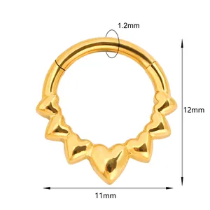 Golden heart-shaped septum clicker ring with five small hearts and 1.2mm gauge bar