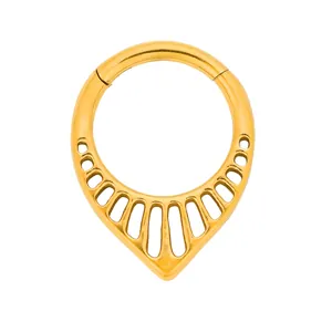 Polished gold stainless steel hinged septum ring with teardrop cutout pattern on white background