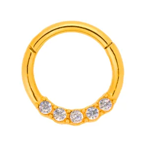 Polished golden stainless steel hinged nose ring with five sparkling zircons