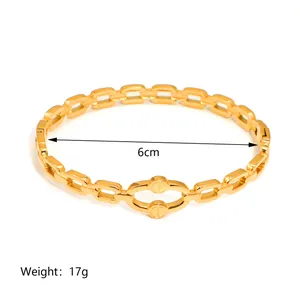 Detail shot of 18K gold plated steel bracelet with screw design link and 6cm diameter