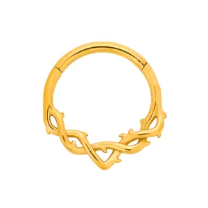 Golden stainless steel hinged segment clicker ring featuring an intricate thorn design