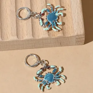 Hawaïaanse stijl emaille krab oorringen in blauw en groen met zilveren sluiting