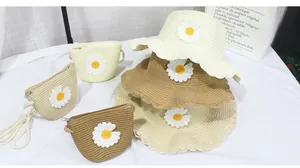 Detailed set of woven straw sun hats and matching crossbody bags with daisy accents