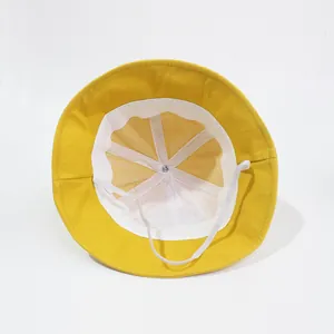 Yellow baby bucket hat with breathable white mesh lining and elastic chin strap