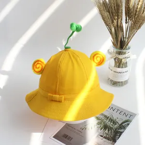 Χαριτωμένο κίτρινο βαμβακερό καπέλο bucket με διακόσμηση βλαστού και φούντες