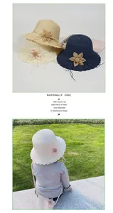 Detail of straw hat and flower bag set for kids featuring scalloped edges in three colors