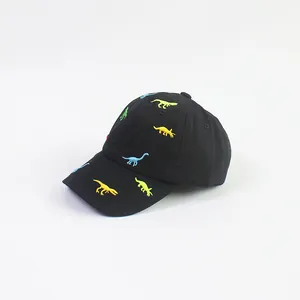Close-up of colorful dinosaur embroidery on the black cotton baseball cap for kids