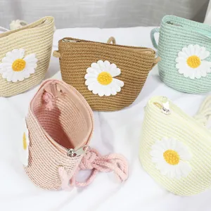 Straw daisy crossbody bags for girls in various colors including pink and beige
