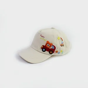 Close-up of cute tiger driving a car embroidery on beige cotton kids baseball cap