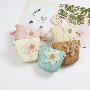 Handmade straw crossbody bags for kids with 3D floral accents in five assorted colors