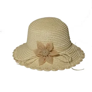 Straw sun hat for girls with flower detail and scalloped brim in light beige