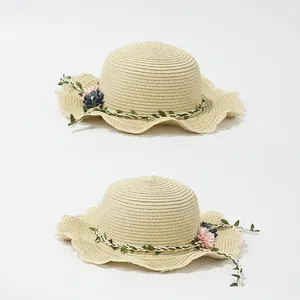 Kids wide brim straw sun hat with floral band and wavy edges for girls summer beach wear