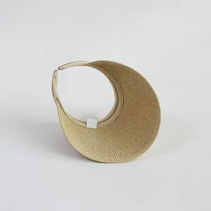 Detailed view of the woven straw texture and inner lining of a beige sun visor hat